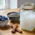 A bowl of kefir mixed with rolled oats, fresh berries, chia seeds, and cinnamon.
